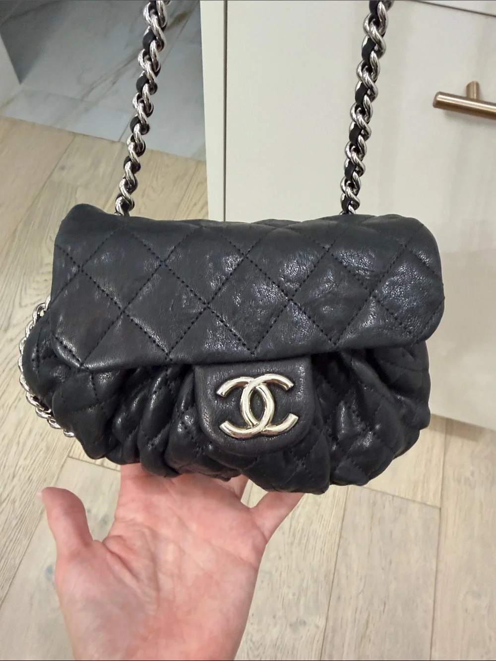 CHANEL Black Quilted leather chain around Crossbody with Silver CC Chain